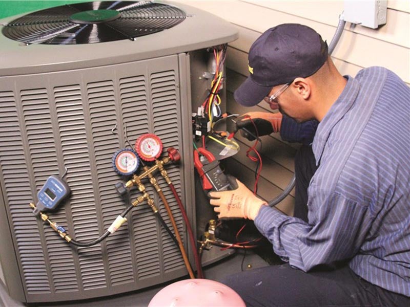 man repairing AC