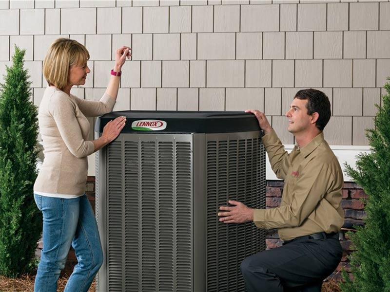 A man and a woman touching a machine