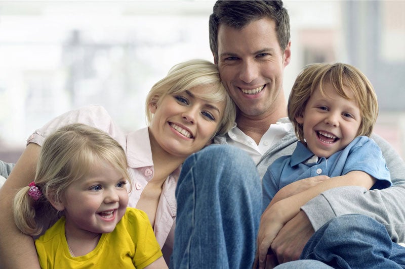 smiling family of four