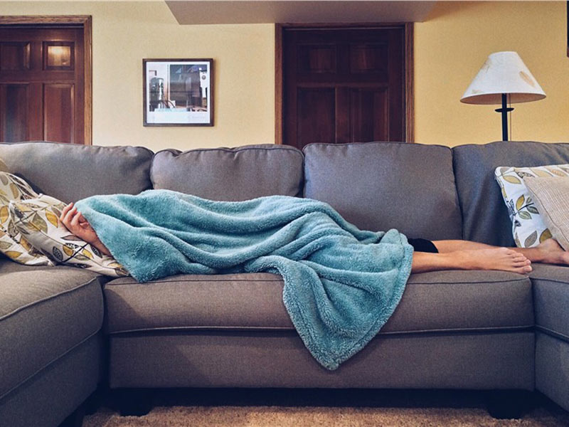 A person sleeping on sofa