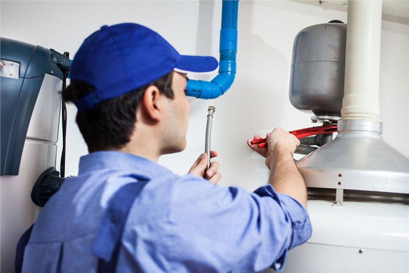 technician working on water heater