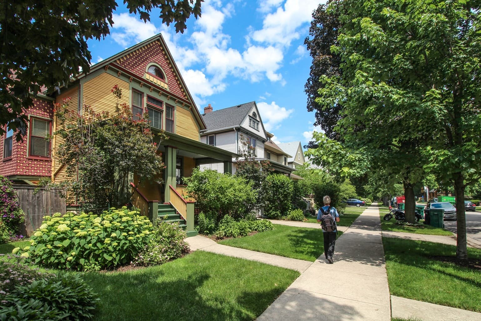 man walking down sidewalk in Oak Park neighborhood